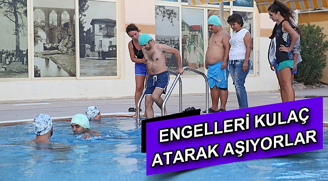 Engelleri kulaç atarak aşıyorlar