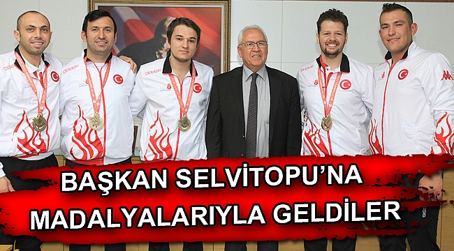 Başkan Selvitopu’na madalyalarıyla geldiler