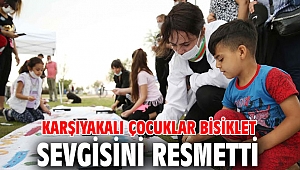 Çocuklar bisiklet sevgisi resmi!