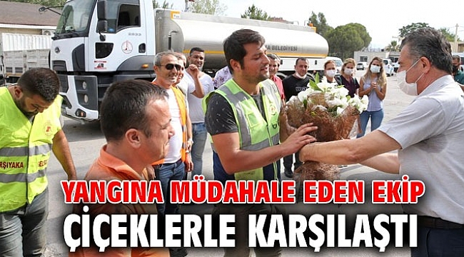 Yangına müdahale eden ekip çiçeklerle karşılandı