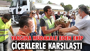 Yangına müdahale eden ekip çiçeklerle karşılandı