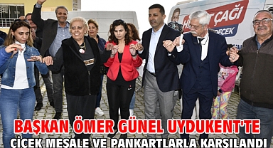 BAŞKAN ÖMER GÜNEL UYDUKENT'TE ÇİÇEK MEŞALE VE PANKARTLARLA KARŞILANDI
