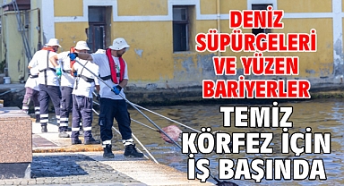 Deniz süpürgeleri ve yüzen bariyerler temiz Körfez için iş başında