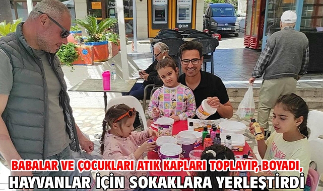 Babalar ve çocukları atık kapları toplayıp, boyadı, hayvanlar için sokaklara yerleştirdi