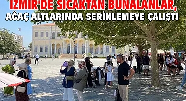 İzmir'de sıcaktan bunalanlar, ağaç altlarında serinlemeye çalıştı